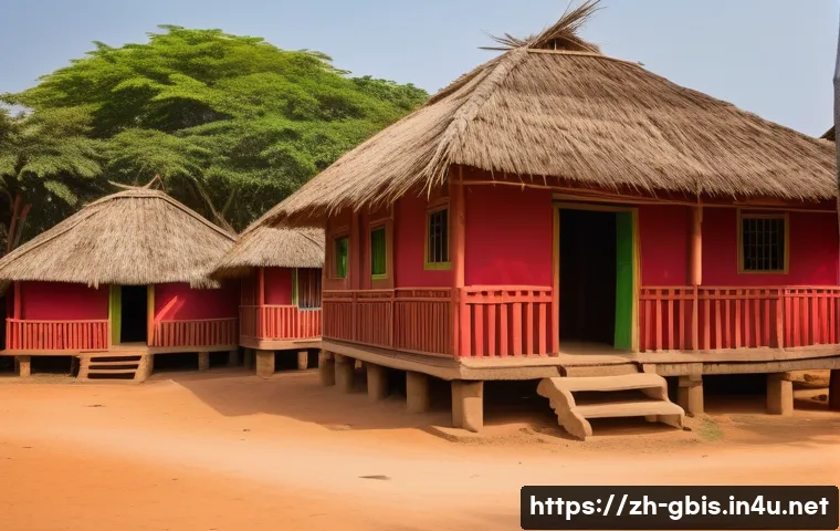 기니비사우의 대표적인 건축 양식 - A traditional Guinean-Bissau village scene under tropical sunlight, featuring houses with tall, stee...